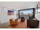 Cozy living room with balcony access, perfect for enjoying city views at 1020 15Th St # 31E, Denver, CO 80202
