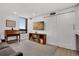 Living room with built in bookcase and flatscreen television at 1020 15Th St # 31E, Denver, CO 80202