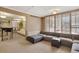Relaxing lounge area with sectional seating, city views, and adjacent wet bar at 1020 15Th St # 31E, Denver, CO 80202