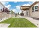 Well-maintained backyard featuring a lush lawn, concrete patio, shed, and privacy fence at 646 Gamble Oak St, Brighton, CO 80601