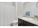 Bathroom featuring a toilet and vanity with dark cabinetry and a white countertop at 646 Gamble Oak St, Brighton, CO 80601