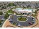 Aerial view of the community clubhouse and parking lot with a roundabout entry at 646 Gamble Oak St, Brighton, CO 80601