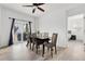 Elegant dining room featuring wood floors, stylish furniture, and plenty of natural light at 646 Gamble Oak St, Brighton, CO 80601
