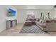 Cozy living room featuring a large sectional sofa, TV, and wood-style floors at 646 Gamble Oak St, Brighton, CO 80601