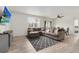 Inviting living room with a large sectional sofa and stylish decor at 646 Gamble Oak St, Brighton, CO 80601