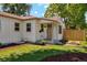 Attractive front yard with tidy landscaping, a well-maintained lawn, and a charming covered entryway at 4467 N Umatilla St, Denver, CO 80211