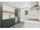Modern kitchen featuring stainless steel appliances, sleek countertops, and contemporary gray cabinets at 4467 N Umatilla St, Denver, CO 80211
