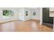 Spacious living area with hardwood floors, large windows, and open layout, perfect for entertaining at 4467 N Umatilla St, Denver, CO 80211