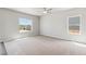 Main bedroom with carpet and a large window to view the backyard at 7306 Arkansas St, Frederick, CO 80530