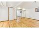 Spacious bedroom with hardwood floors, a closet, and neutral colored walls offering a blank canvas at 14582 E Harvard Ave, Aurora, CO 80014