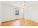 Bedroom with hardwood floors, closet and window at 14582 E Harvard Ave, Aurora, CO 80014