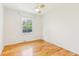 Bedroom with hardwood floors and large window at 14582 E Harvard Ave, Aurora, CO 80014