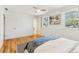 Bright bedroom features hardwood floors and natural light at 14582 E Harvard Ave, Aurora, CO 80014