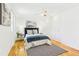 Bright bedroom features hardwood floors, ceiling fan, and ample closet space at 14582 E Harvard Ave, Aurora, CO 80014
