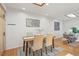 Cozy dining room featuring modern décor, a wooden table, and seating for four at 14582 E Harvard Ave, Aurora, CO 80014