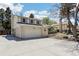 Lovely light brick home featuring a spacious two-car garage and well-maintained yard at 14582 E Harvard Ave, Aurora, CO 80014