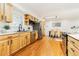 Stylish kitchen with stainless steel appliances, wooden cabinetry, and white countertops at 14582 E Harvard Ave, Aurora, CO 80014
