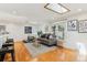 Cozy living room filled with natural light, featuring hardwood floors and comfortable seating at 14582 E Harvard Ave, Aurora, CO 80014