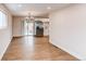 The dining area features sliding glass doors to the back yard with stainless steel appliances and hardwood floors at 2372 Paris St, Aurora, CO 80010