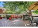 Spacious back deck with comfortable seating and room for outdoor dining with mature tree providing shade at 1419 N Adams St, Denver, CO 80206