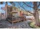 Backyard featuring a spacious wood deck, rock garden, and outdoor dining area, perfect for entertaining guests at 1419 N Adams St, Denver, CO 80206