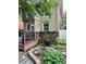 Inviting outdoor deck with a grill, greenery, stone pavers, and a dining set at 1419 N Adams St, Denver, CO 80206