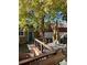 Backyard deck with outdoor seating, grill, stone pavers, and privacy fencing at 1419 N Adams St, Denver, CO 80206