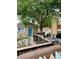 A shaded backyard deck with outdoor seating, greenery, and a grill at 1419 N Adams St, Denver, CO 80206