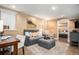 Basement living space with a gray sofa, wood accent wall, and an open floor plan at 1419 N Adams St, Denver, CO 80206