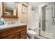Bathroom featuring a glass-enclosed shower and wood vanity at 1419 N Adams St, Denver, CO 80206