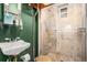 Stylish bathroom with tiled shower and uniquely designed fixtures at 1419 N Adams St, Denver, CO 80206