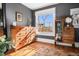 Vintage-style bedroom with wooden floors and large dresser at 1419 N Adams St, Denver, CO 80206