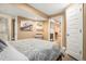Bedroom featuring wood accents and en-suite bathroom at 1419 N Adams St, Denver, CO 80206