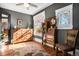 Bedroom with wooden floors, a vintage dresser and natural light from window at 1419 N Adams St, Denver, CO 80206