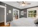 Bedroom featuring neutral paint, ceiling fan, hardwood flooring, and natural light from a window at 1419 N Adams St, Denver, CO 80206