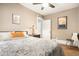 Bedroom with a ceiling fan, warm tones, and bright white trim and doors at 1419 N Adams St, Denver, CO 80206