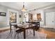 Bright dining room featuring hardwood floors, modern light fixture, and a stylish table setting at 1419 N Adams St, Denver, CO 80206