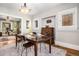 Bright dining room featuring hardwood floors, view into the living room and a classic cabinet at 1419 N Adams St, Denver, CO 80206