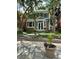 Two-story home exterior featuring well-maintained landscaping, planters, and a stone walkway at 1419 N Adams St, Denver, CO 80206