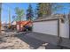 Spacious two-car garage with modern doors, an adjacent parking spot, and a small storage garage at 1419 N Adams St, Denver, CO 80206