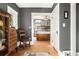 Hallway leading to Primary bedroom, showing hardwood floors, decorative trim, and bedroom features at 1419 N Adams St, Denver, CO 80206
