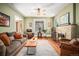 Comfortable living room with a fireplace, hardwood floors, and plenty of seating at 1419 N Adams St, Denver, CO 80206