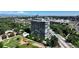 A scenic aerial view shows the building's modern architecture and lush green surroundings with a beautiful park at 3100 E Cherry Creek South Dr # 1507, Denver, CO 80209