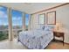 This bedroom features city views, contemporary décor, and comfortable furnishings for relaxation at 3100 E Cherry Creek South Dr # 1507, Denver, CO 80209