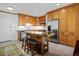 Eat-in kitchen features custom island, stainless steel appliances, ample cabinetry, and modern lighting at 3100 E Cherry Creek South Dr # 1507, Denver, CO 80209