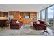 Inviting living area with built-in shelving, cozy seating, and expansive windows, offering both comfort and style at 3100 E Cherry Creek South Dr # 1507, Denver, CO 80209