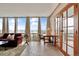Bright living room featuring expansive windows with city views, tile flooring, and a comfortable seating area at 3100 E Cherry Creek South Dr # 1507, Denver, CO 80209
