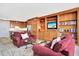 Open floor plan showcasing the living room's built-ins, comfortable seating, and seamless flow to the kitchen at 3100 E Cherry Creek South Dr # 1507, Denver, CO 80209