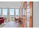Comfortable seating area with a view through french doors and a wall of windows at 3100 E Cherry Creek South Dr # 1507, Denver, CO 80209
