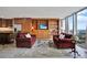 Inviting living area with built-in shelving, cozy seating, and expansive windows, offering both comfort and style at 3100 E Cherry Creek South Dr # 1507, Denver, CO 80209